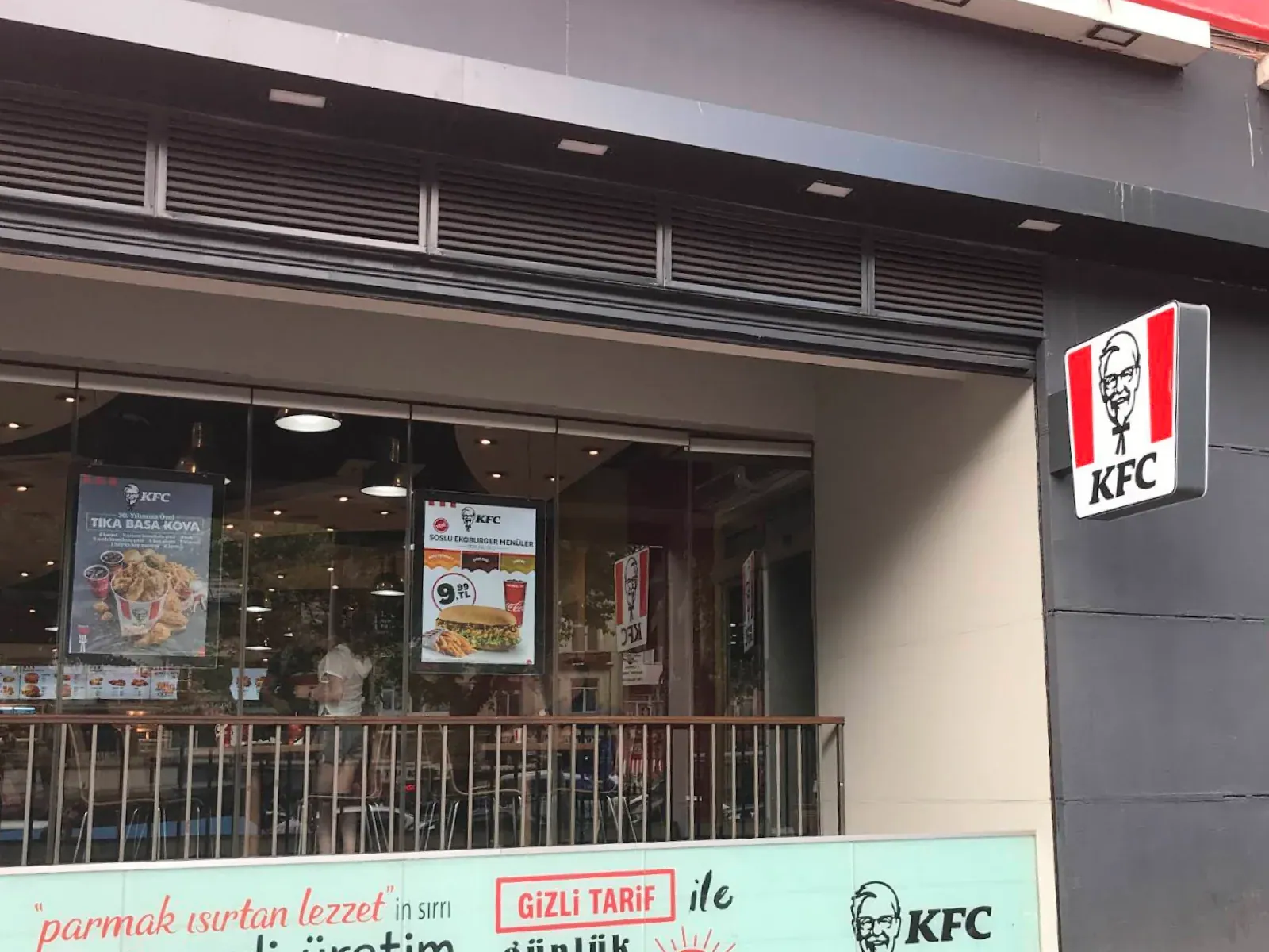 KFC menu boards above the order counter