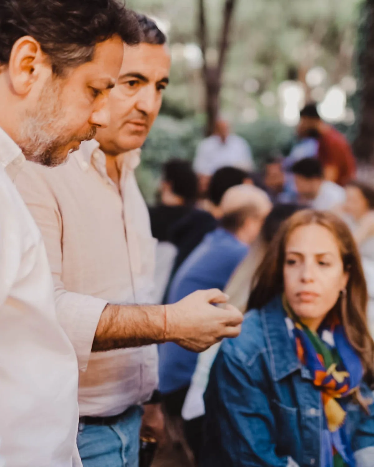 Two OmmaWorks colleagues talking during an outdoor team gathering
