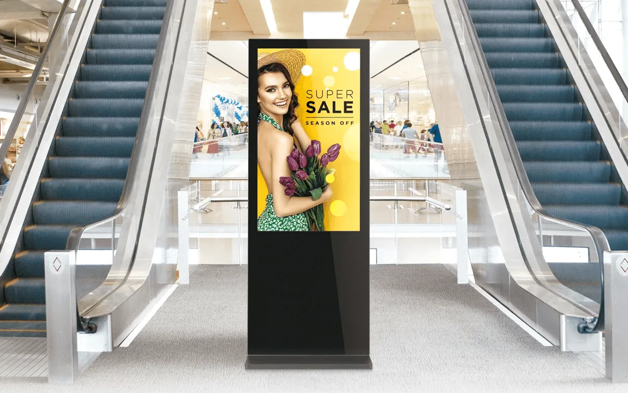 An LG webOS freestanding digital signage display running retail content in a shopping mall