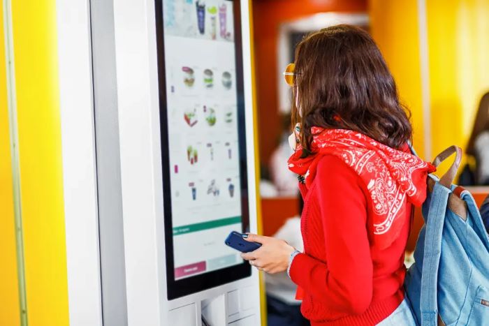 indian man at fast food cafe 2023 11 27 04 52 56 utc shutterstock 1081674875